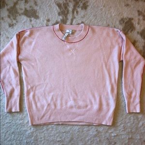 Pink Madewell women’s cashmere sweater with red stitching